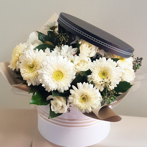 Chrysanthemums Roses And Gerberas In Hatbox